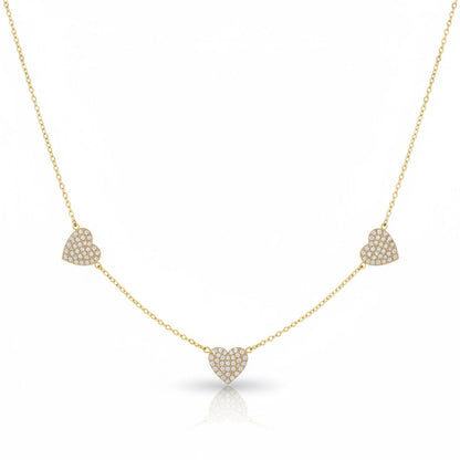 Gold necklace with heart-shaped pendants on a white background