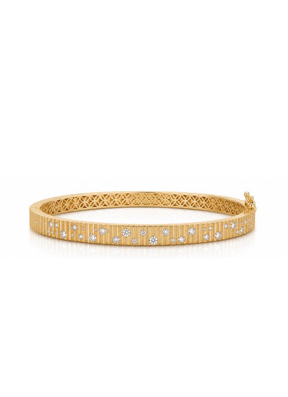 14k gold plated bangle with dispersed cubic zirconia stones. Hinged bangle with safety clasp. 