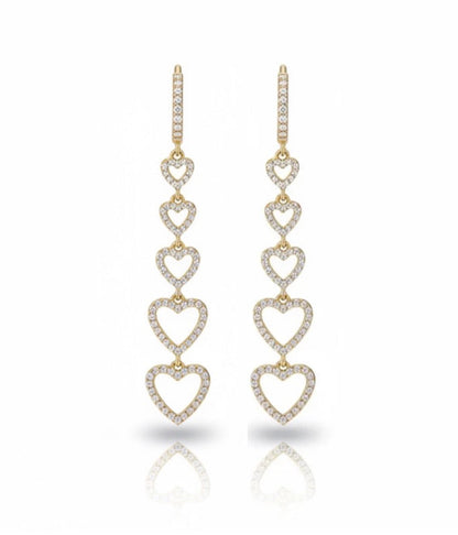 Gold heart-shaped earrings with diamond accents on a white background