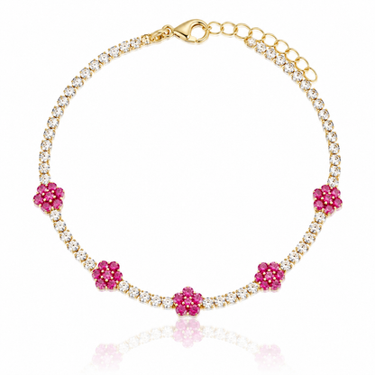 Gemstone Flower Bracelet in gold, pink gemstone flower stations on a CZ tennis bracelet chain with a half inch extension. 